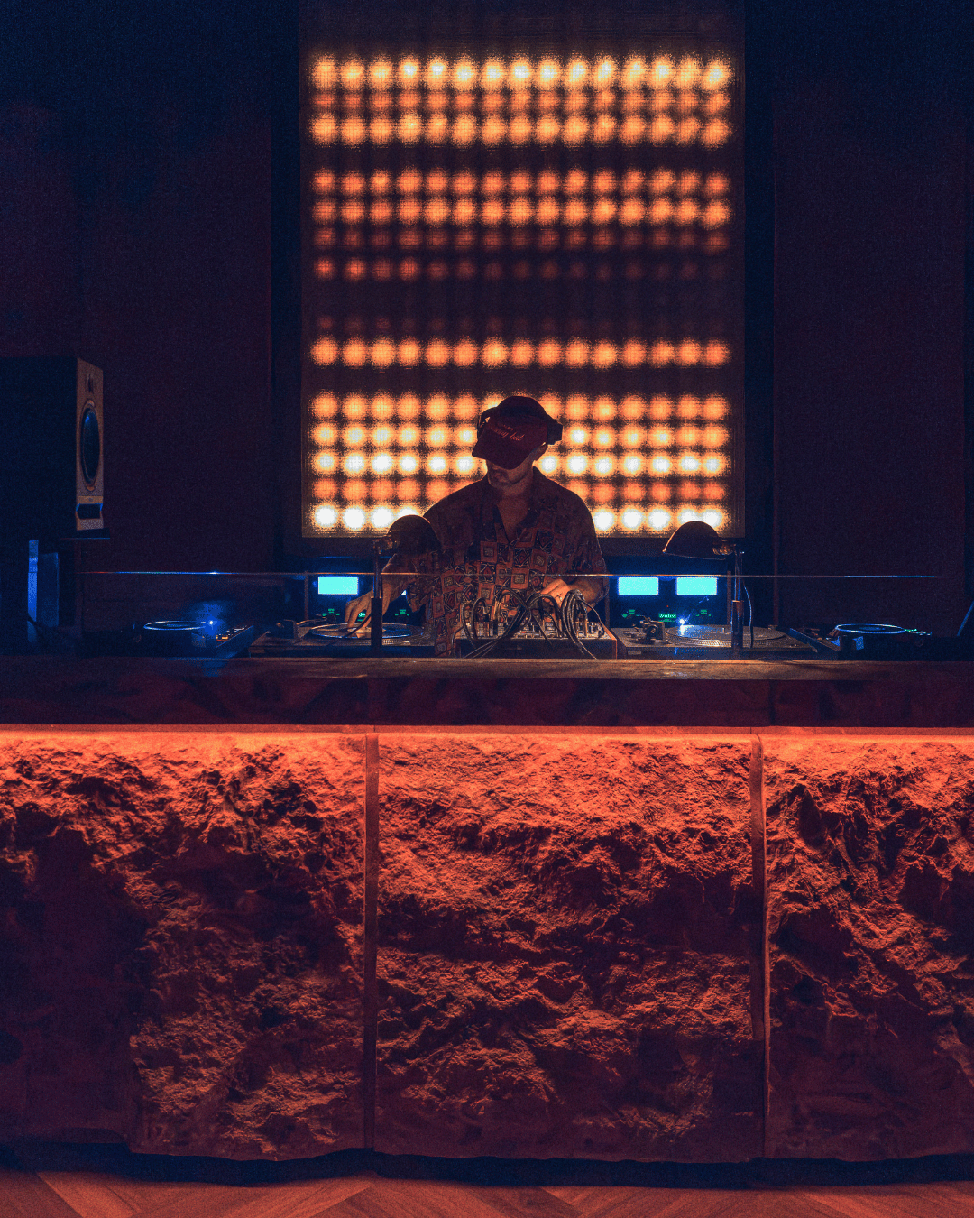 DJ at Marte Hi Fi’s illuminated music booth