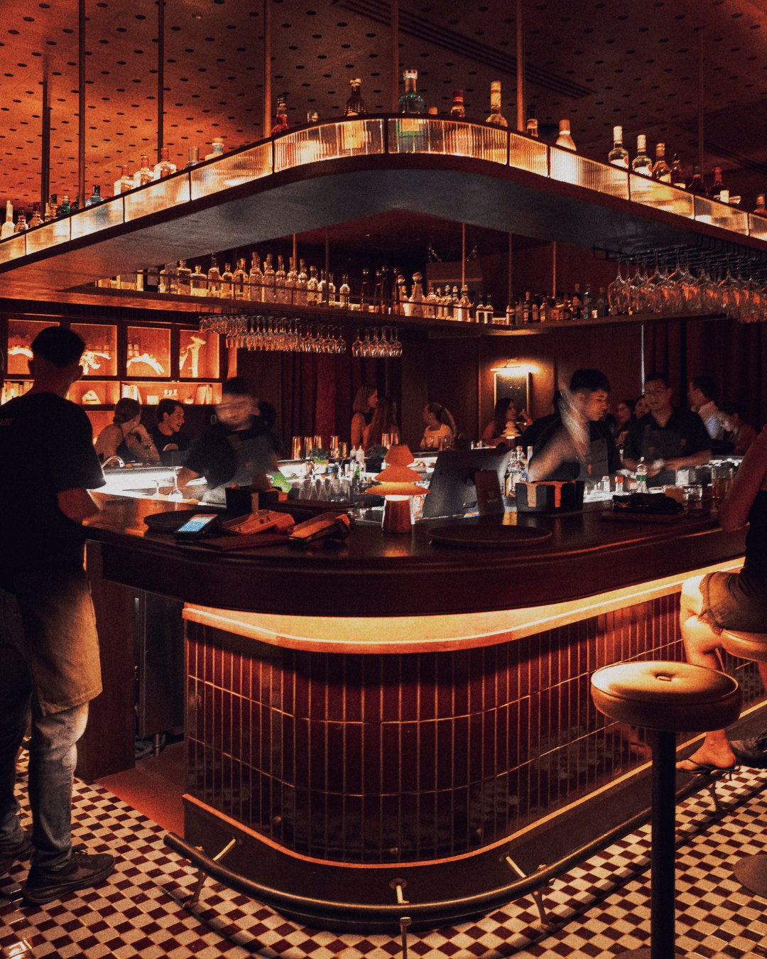Warm amber lighting around the bar at Marte Hi Fi in Ánima Village