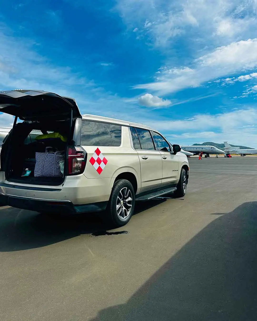 White All Ways Cabo SUV photographed with its luggage hatch open